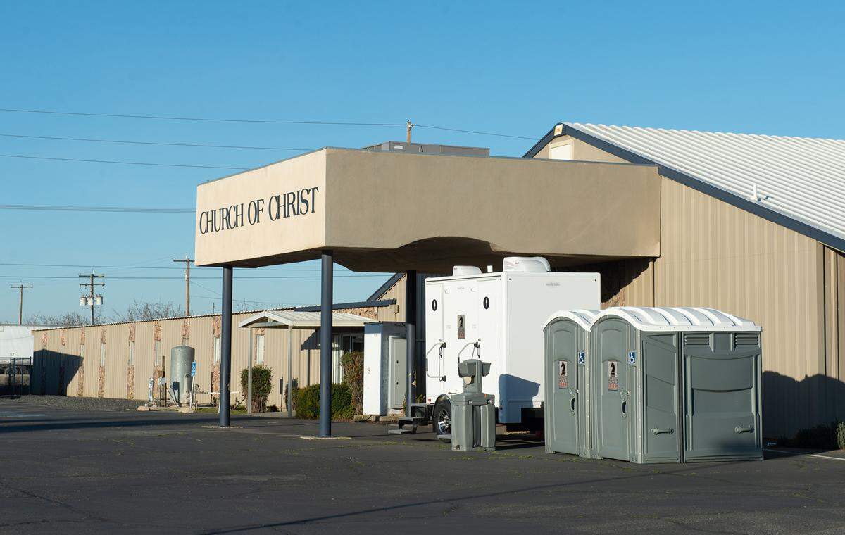 The Hughson Church of Christ brought in portable toilets after a sewer leak in Hughson, Calif., Tuesday, Jan. 31, 2023. The church is stuck between the city and a city contractor, and has been without working bathrooms for two months after a sewer project misfired in early December.