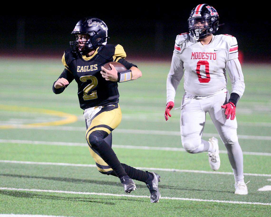 Enochs quarterback Johnny Staggs (2) scrambles upfield during a game between Modesto High School and Enochs High School at Gregori High School in Modesto, CA on October 4, 2024.