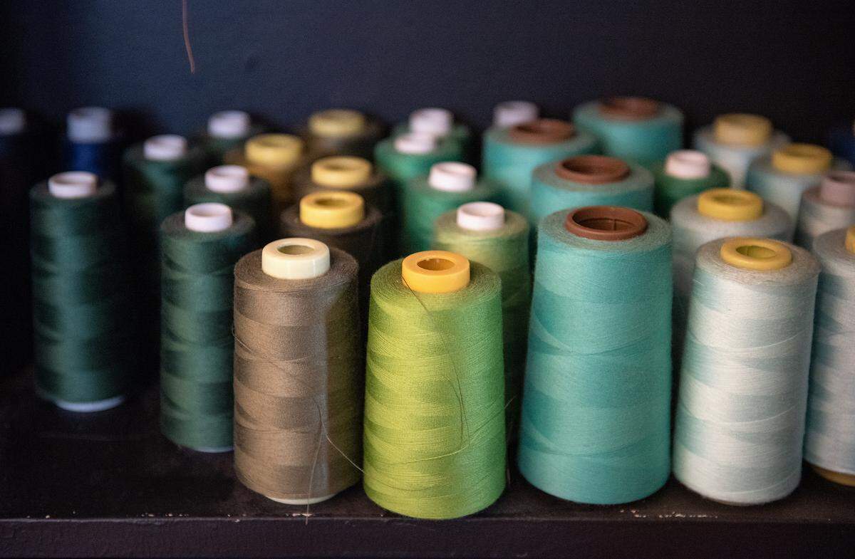 Spools of thread in the workspace of designer Stephanie Oyervides above the The Taste Studio boutique on J Street in Modesto, Calif., on Wednesday, Dec. 29, 2021.