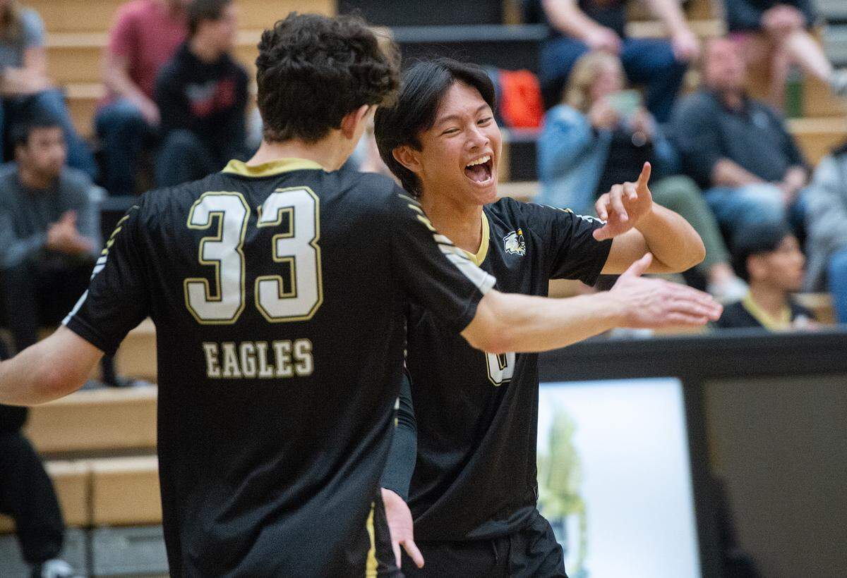 Enochs’ Matthew Suico, right, and Francis Gates celebrate an ace during the Central California Athletic League match at Enochs High School in Modesto, Calif., Tuesday, April 4, 2023. Enochs won the match 3-1.