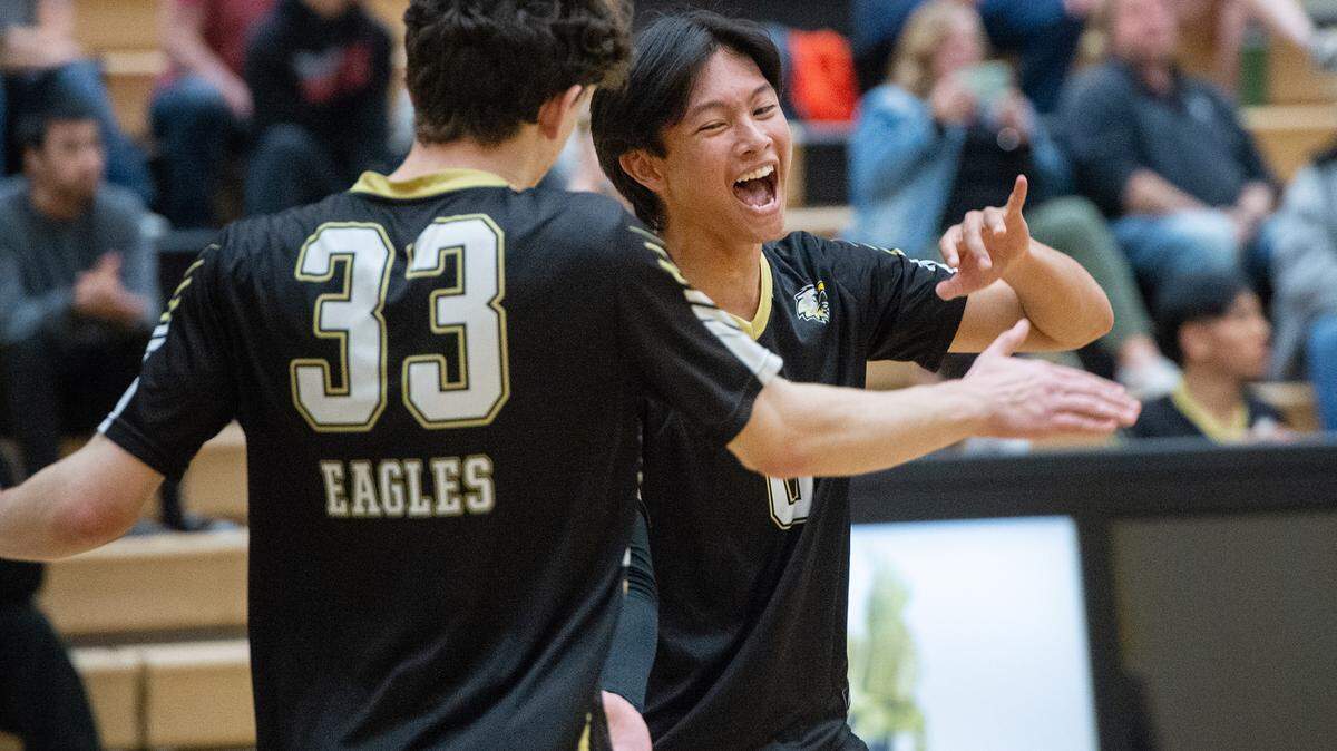 Enochs’ Matthew Suico, right, and Francis Gates celebrate an ace during the Central California Athletic League match at Enochs High School in Modesto, Calif., Tuesday, April 4, 2023. Enochs won the match 3-1.
