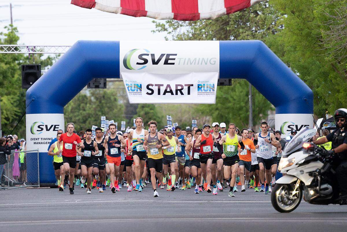 Runners start the Modesto Marathon in Modesto, Calif., on Sunday, March 27, 2022.