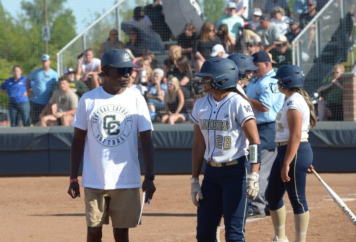 Central Catholic coach Sam Nichols and shortstop Taryn Calderon talk during a timeout in the Sac-Joaquin Section Division III championship against Ponderosa at Cosumnes River College on Saturday, May 27. Central Catholic lost 1-0.