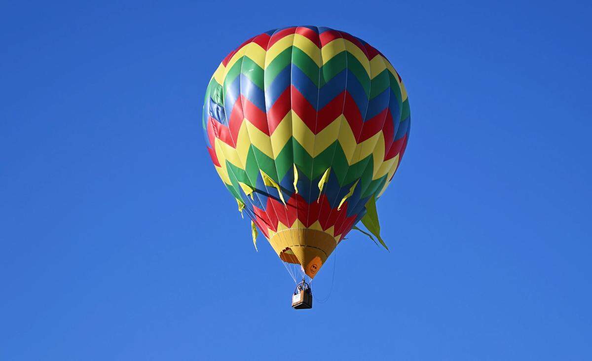 A balloon flies off from River Bluff Regional Park during the 2024 Skies the Limit Ceres Hot Air Balloon Festival.