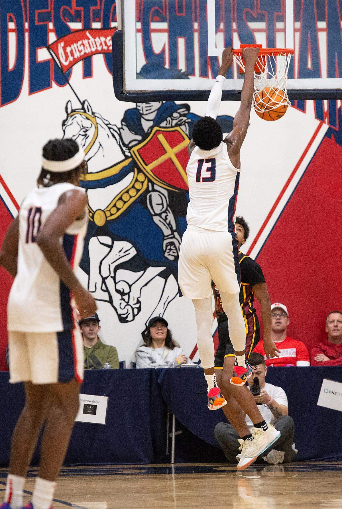 Modesto Christian’s Prince Oseya dunks the ball during the Modesto Christian Holiday Hoop Classic championship game with Clovis West at Modesto Christian High School in Salida, Calif., Friday, Dec. 30, 2022. MC won the game 79-55.