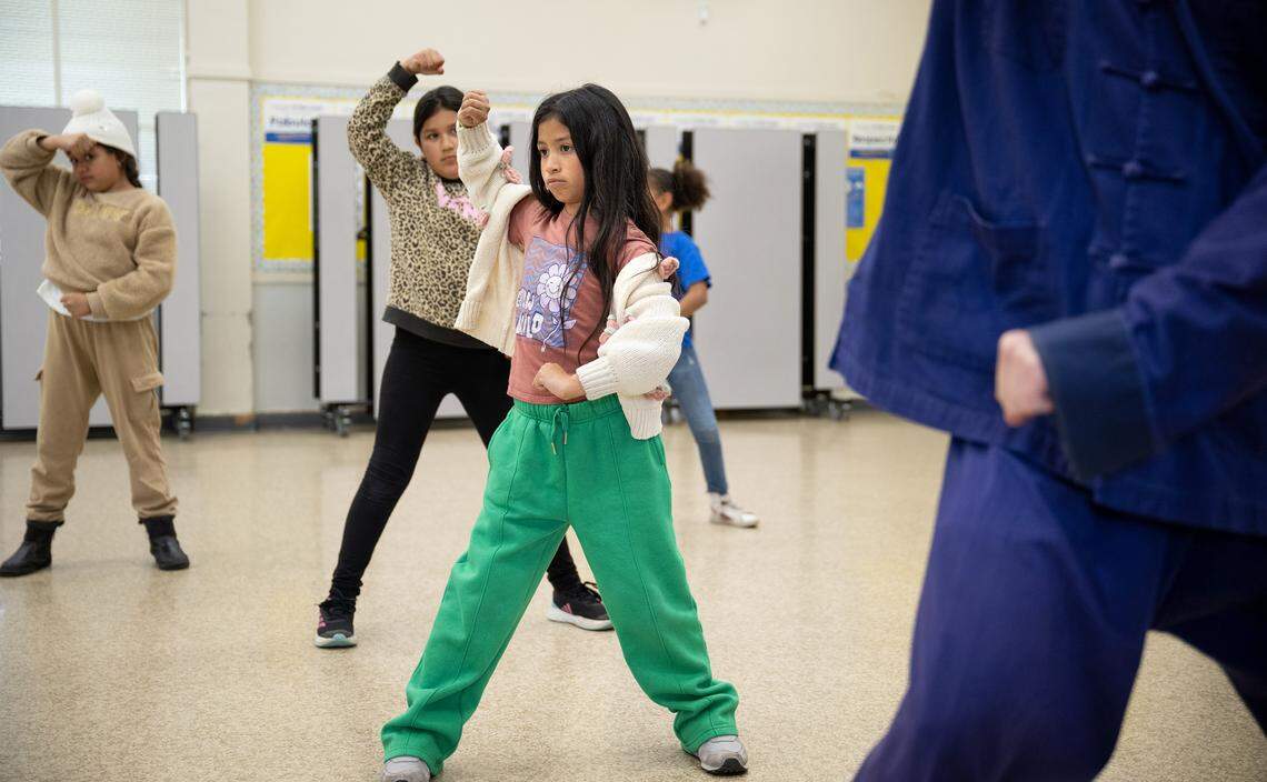 Third-grader Ashley Jimenez participates in tai chi with classmates at Orville Wright Elementary School in Modesto on Thursday, March, 13, 2025.