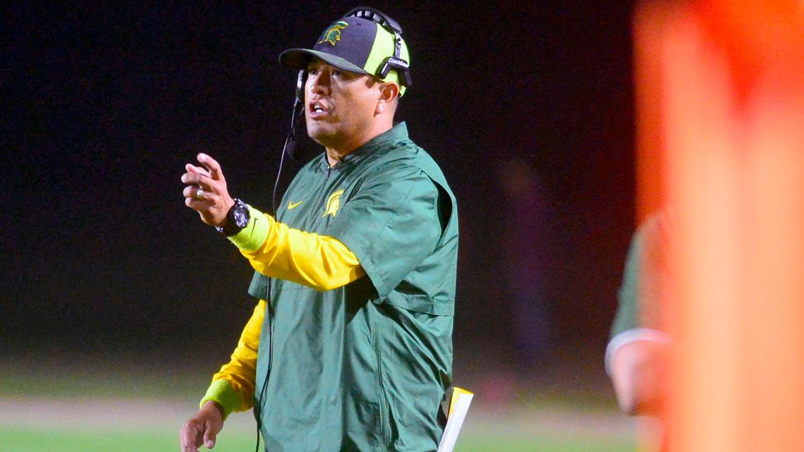 Davis head coach Tim Garcia calls a play from the sideline during a game between Davis and Johansen at Johansen High School in Modesto, CA on October 25, 2019.
