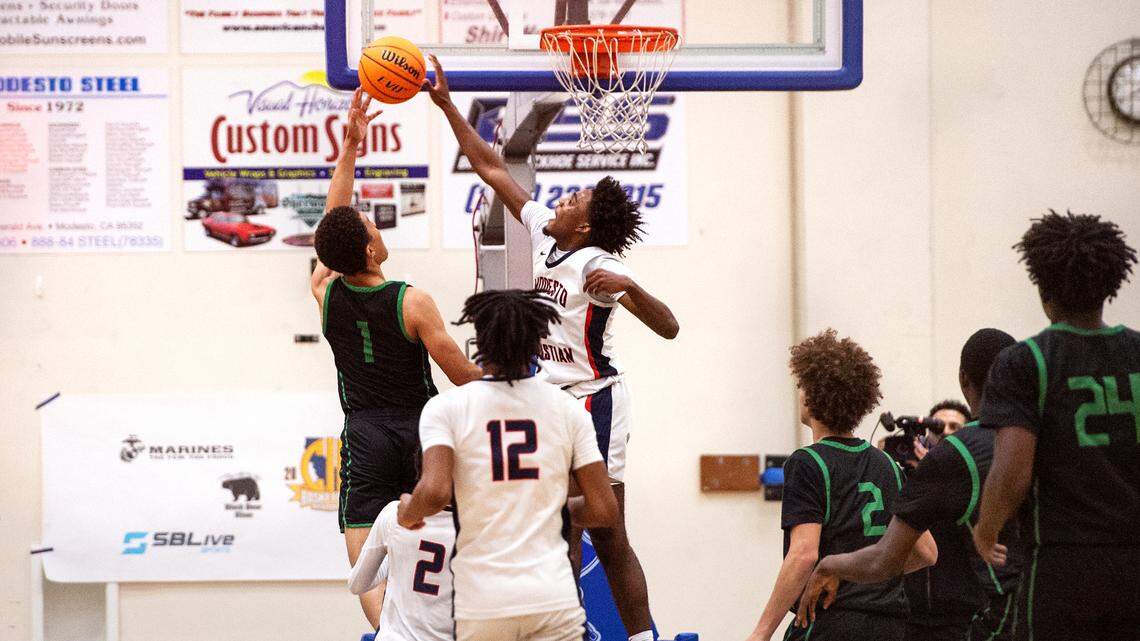 Modesto Christian’s Jalen Brown blocks the layup of St. Joseph’s Julius Price in the NorCal Open Division championship game at Modesto Junior College in Modesto, Calif., Tuesday, March 7, 2023. St. Joseph won the game 72-58.