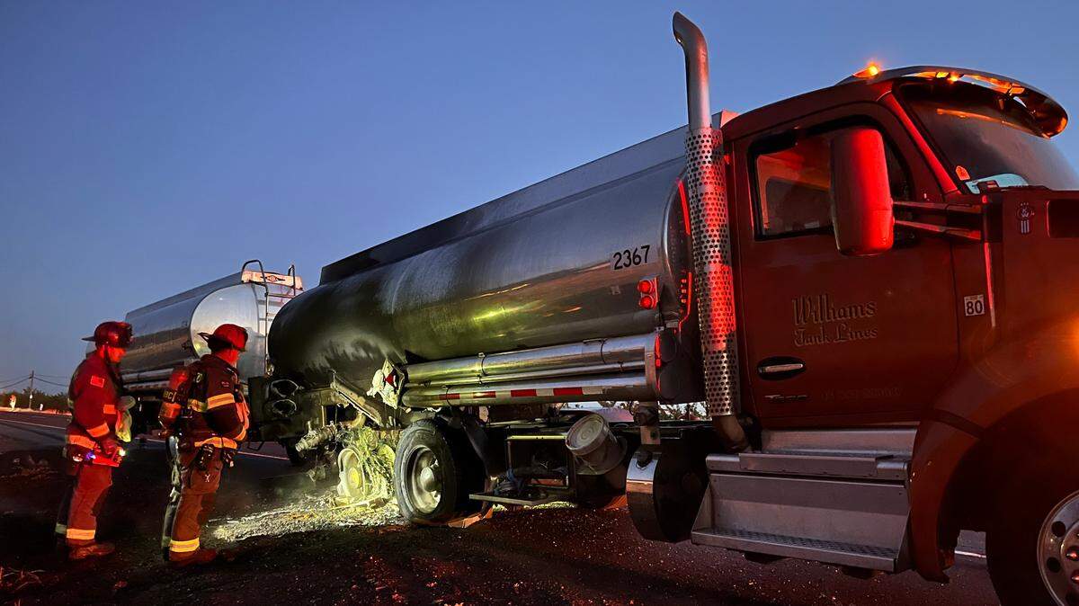 A gas tanker truck burns along the side of Highway 120 outside Oakdale on June 21, 2025.