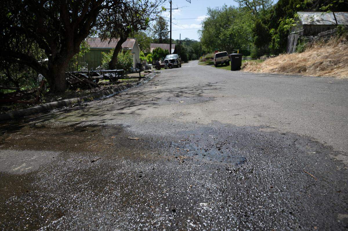 Water bubbles up from the asphalt on Vantine Street in Knights Ferry, Wednesday, April 16, 2025.