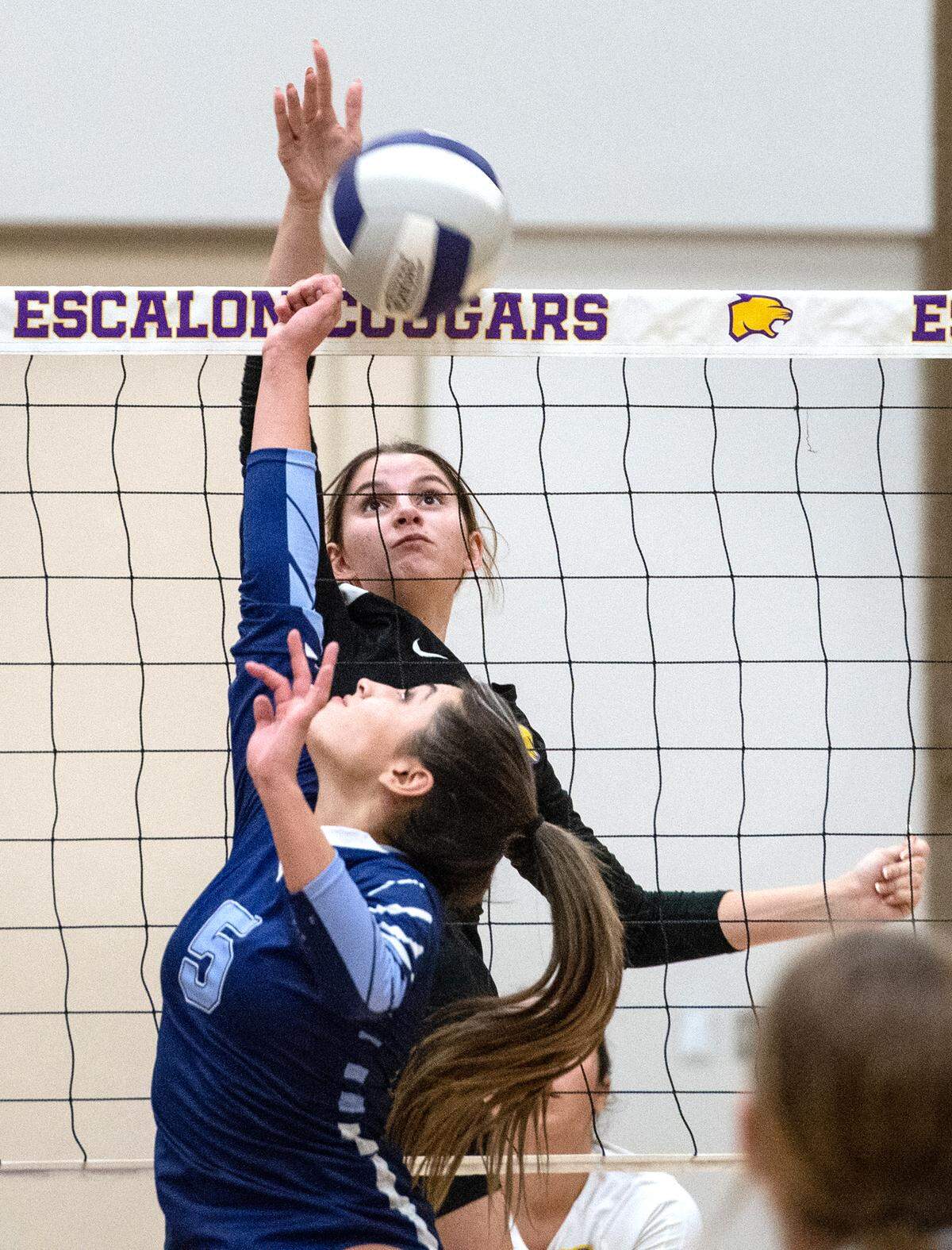 Escalon Sophia Martin puts the ball back for a winner as Downey’s Ivy Perez defends during a non-league match in Escalon, Calif., on Tuesday, September 27, 2022.