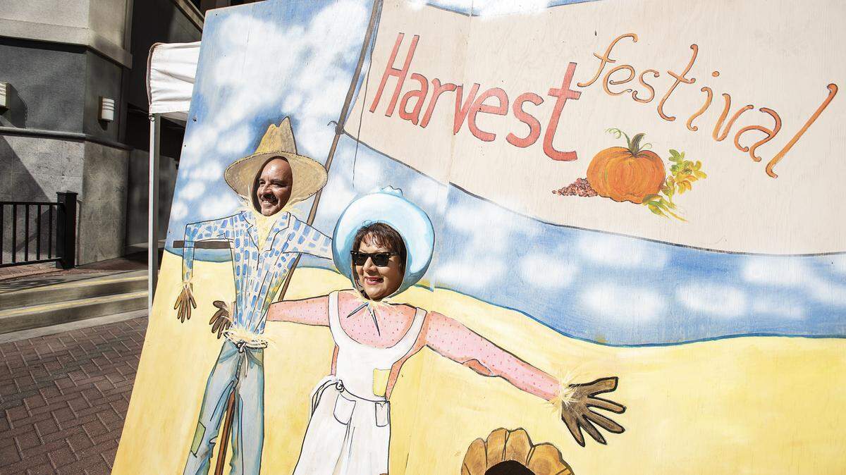 Cecilia and Jorge Madrigal of Modesto pose for a picture during the Harvest Festival in downtown Modesto, Calif., Saturday, Oct. 12, 2019.