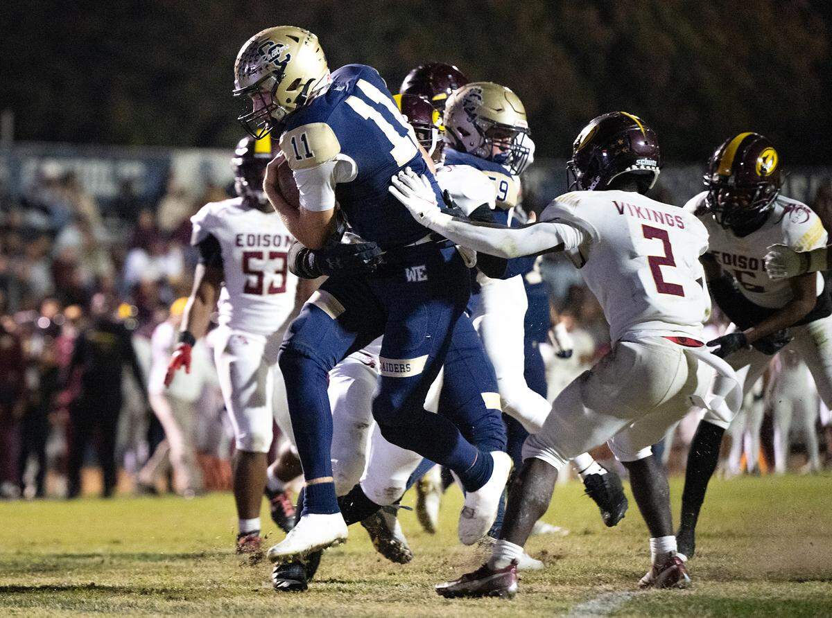 Central Catholic quarterback Tyler Wentworth runs in for a touchdown during the Sac-Joaquin Section Division I quarterfinal game with Edison at Central Catholic High School in Modesto, Calif., Friday, Nov. 10, 2023. Central Catholic won the game 34-20.