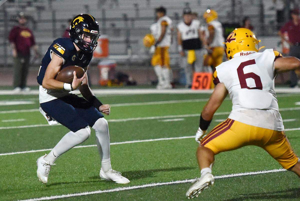 Gregori quarterback Mason Durao runs the ball during the game with Los Banos in Modesto, Friday, Sept. 19, 2025.  