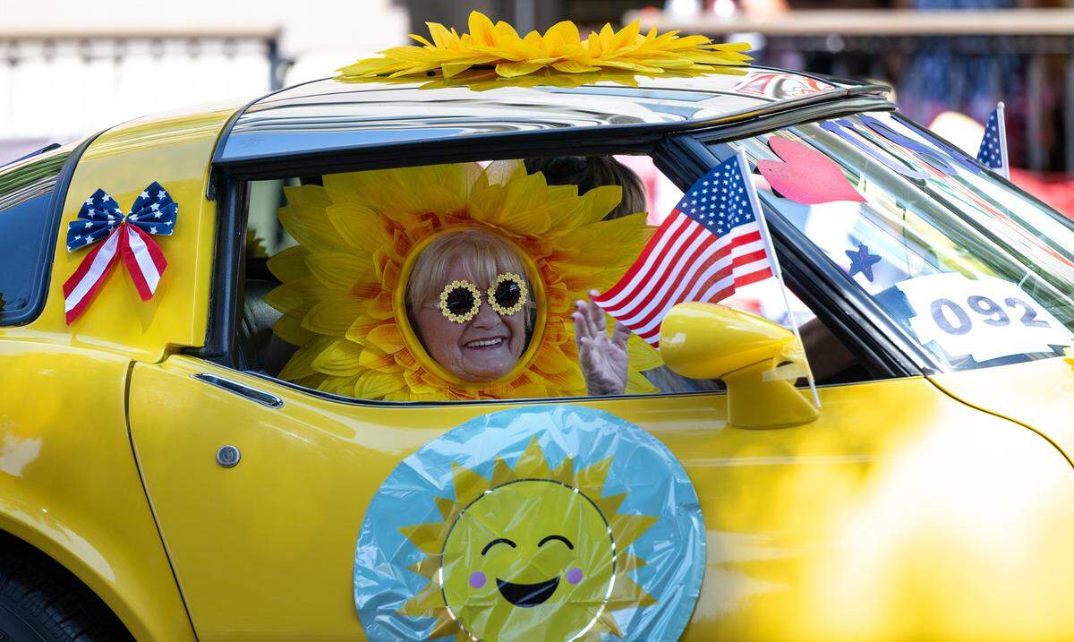 Members of the Corvette car club pass on J Street during the Independence Day Parade in Modesto, Calif., Tuesday, July 4, 2023.
