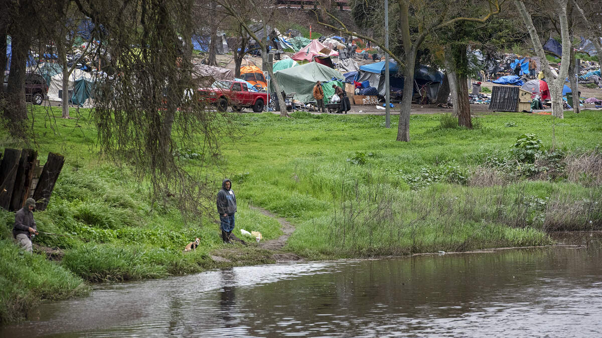 Dry Creek running high after recent storms and Beard Brook Park campers prepare to leave the park in Modesto, Calif., Tuesday, March 5, 2019.