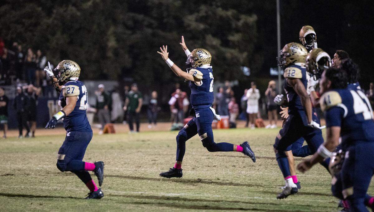 Central Catholic players run onto the field in celebration after the final defensive stop to give them the 39-35 win over Manteca during the Valley Oak League game at Central Catholic High School in Modesto, Calif., Friday, Oct. 20, 2023.
