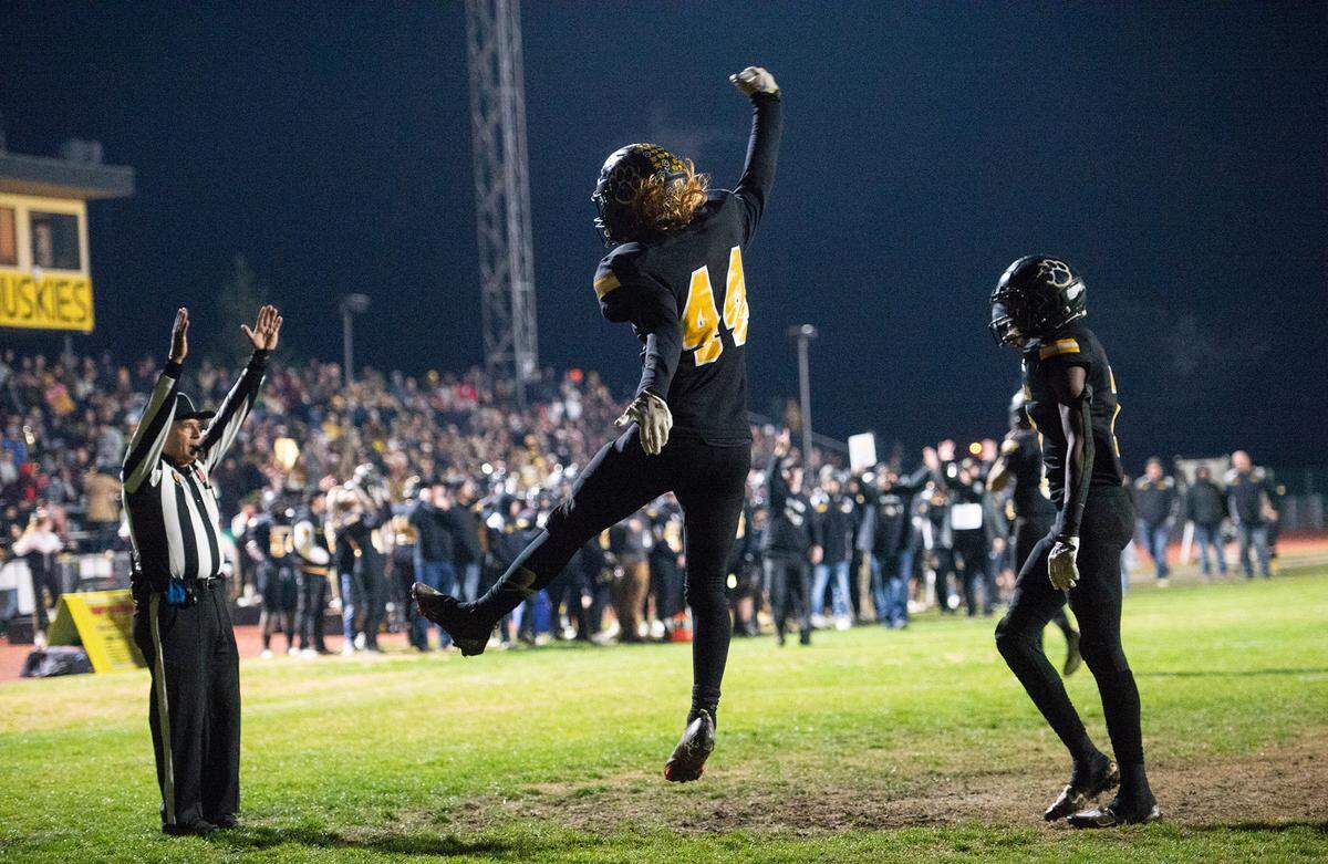 Hughson’s Liam Bridgford celebrates a rushing touchdown during the CIF Division 5-AA Northern California Regional Bowl Game with Ripon Christian on Friday, Dec. 2, 2022, in Hughson, Calif. Hughson won the game 31-28.