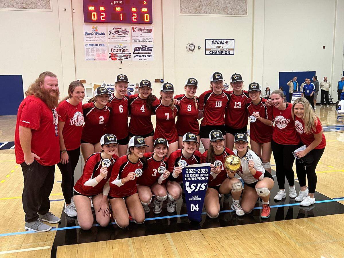 Ripon High players and coaches celebrate winning the Sac-Joaquin Section Division IV volleyball championship at Modesto Junior College on Saturday, Nov. 5, 2022. The Indians defeated Sonora, 3-1.