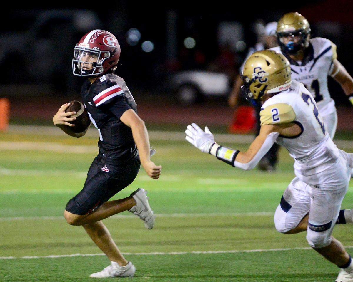 Patterson quarterback Max Medina (3) scrambles during a game between Central Catholic High School and Patterson High School at Patterson High School in Patterson California on September 9, 2024. Central Catholic won the game 25-14
