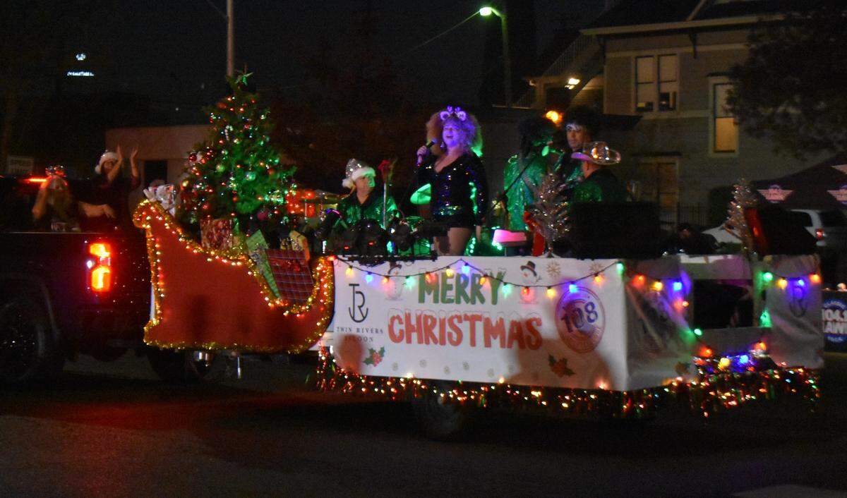 A band performs on the Twin Rivers Saloon float on Saturday night, Dec. 7, 2024, in the Celebration of Lights Holiday Parade in downtown Modesto.