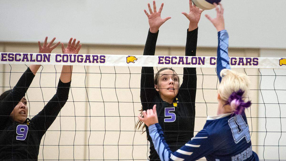 Escalon’s Lisa Murga (9) and Emily Vickers (5) defend against Downey’s Izzy Watson during a non-league match in Escalon, Calif., on Tuesday, September 27, 2022.