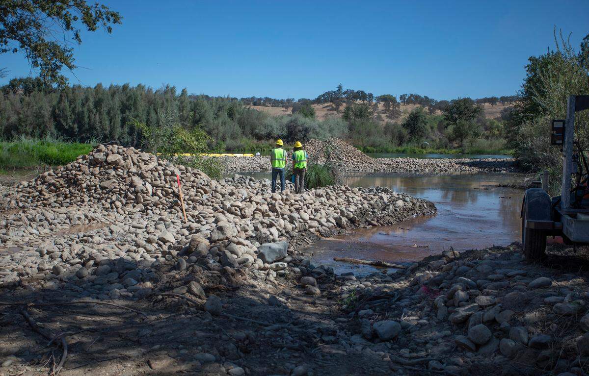 Work on a dredging pit in August. The pit was filled in to reestablish a low wetland.