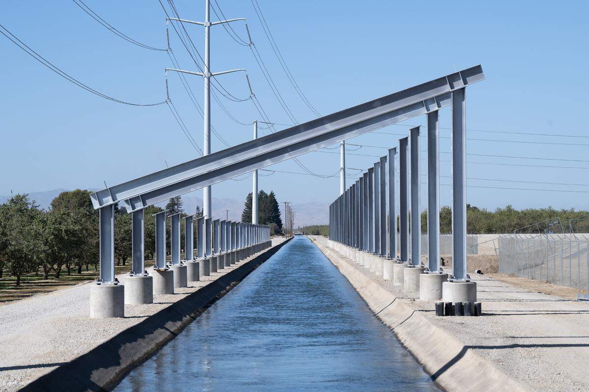 Project Nexus, a Turlock Irrigation District pilot project using solar arrays to cover irrigation canals, is under construction southwest of Keyes, Thursday, Oct. 17, 2024.