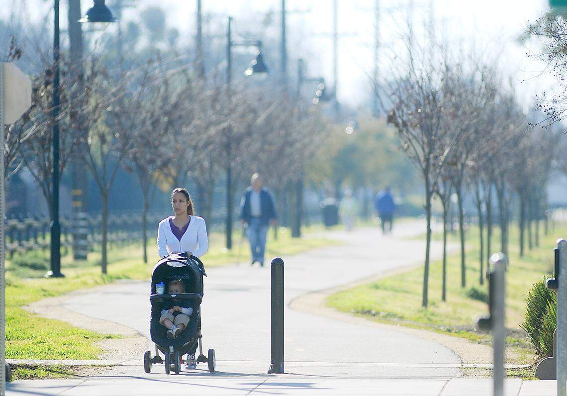 Babysitter Chelsea Watkins pushes young Cooper along the Virginia corridor walking path from a stroller in 2013.