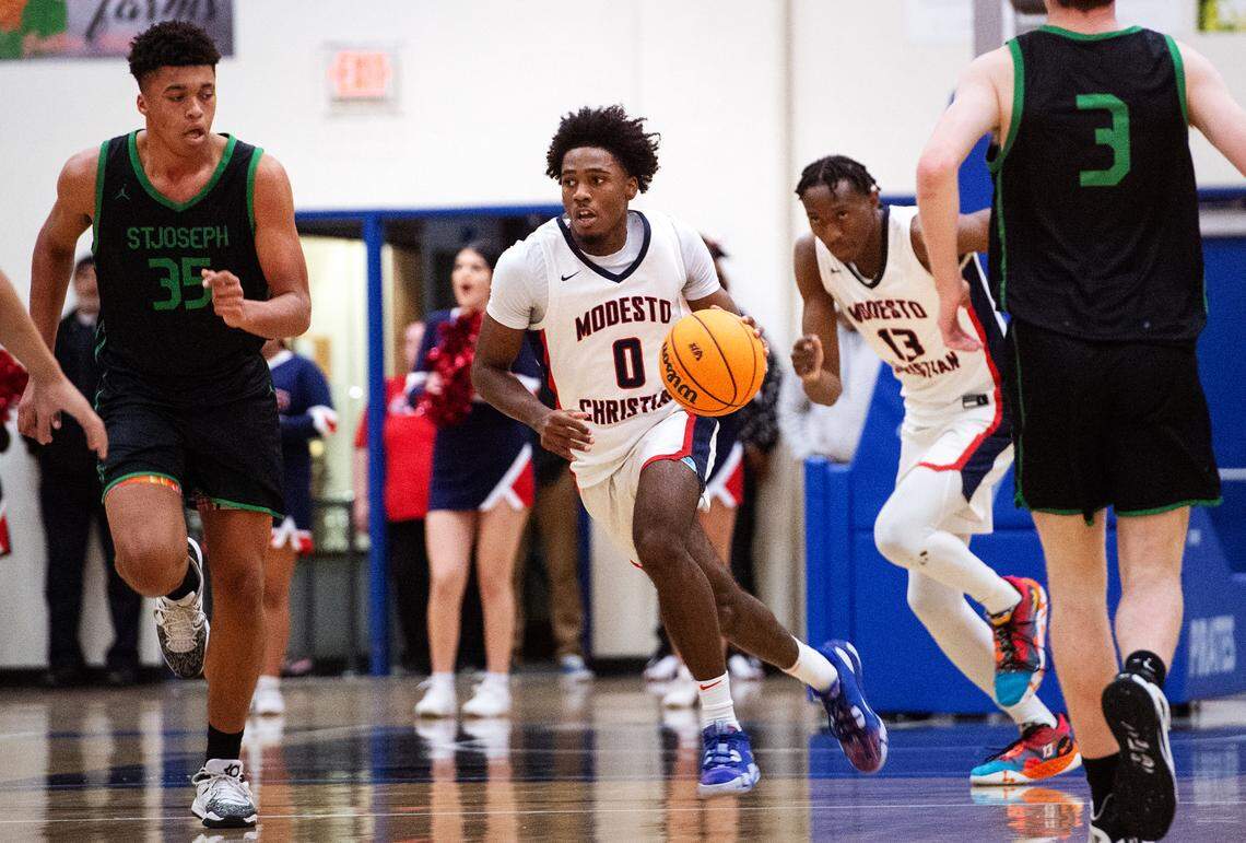 Modesto Christian’s Jalen Brown brings the ball forward during the NorCal Open Division championship game with St. Joseph at Modesto Junior College in Modesto, Calif., Tuesday, March 7, 2023.