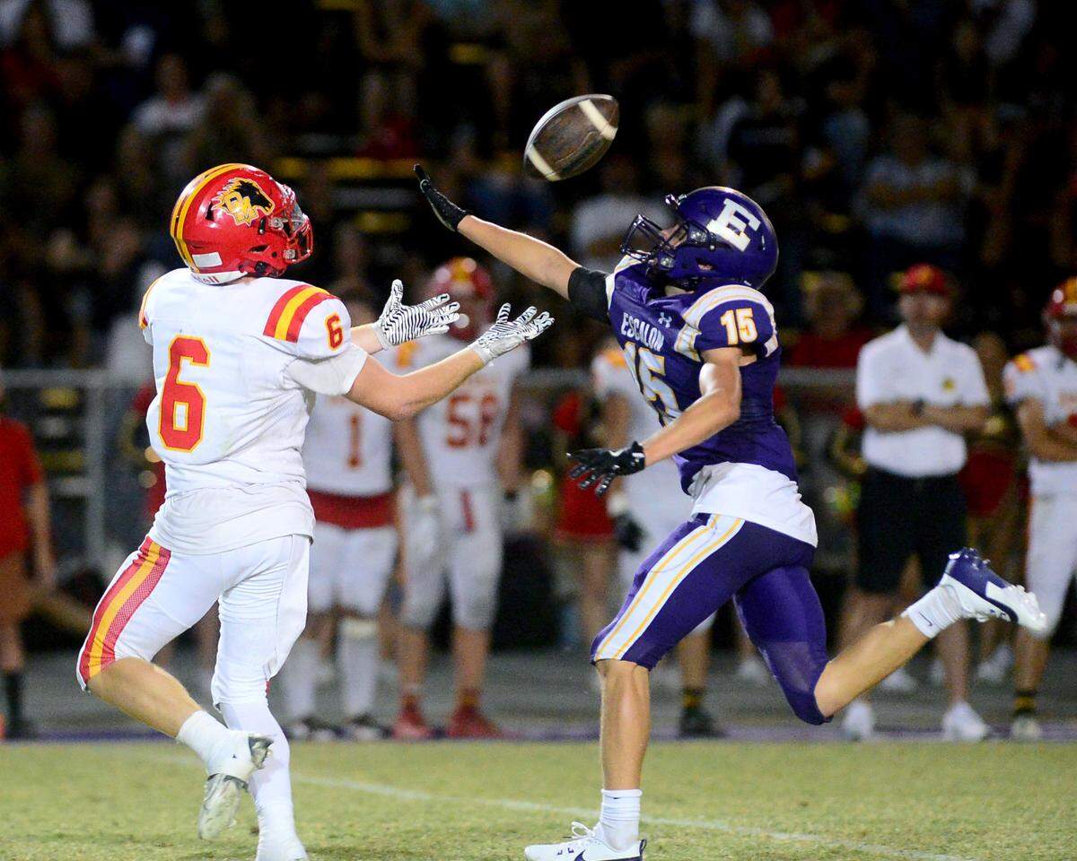 Escalon defensive back Ben Ferreira (15) deflects a pass intended for Oakdale’s Chase Lopez (6) during a game between Escalon High School and Oakdale High School in Escalon, Calif. on Sept. 6, 2024. Oakdale won the game 21-20 in overtime.
