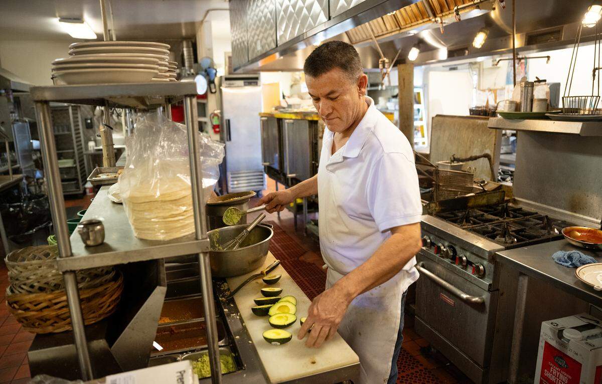 Jorge Garcia cooks in the kitchen at Marcella’s Mexican restaurant in Modesto, Monday, Jan. 13, 2025.