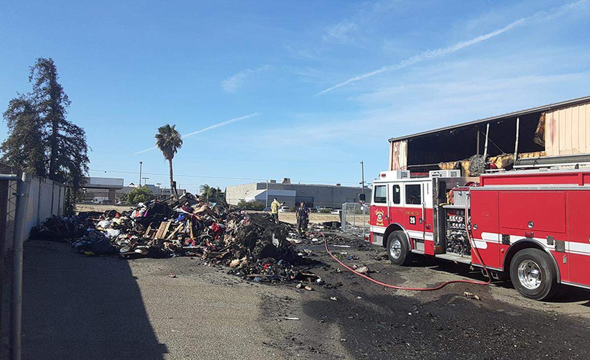 Firefighters continue mop up work Friday morning from Thursday’s fire at The Salvation Army Family Thrift Store and Donation Center on north McHenry Avenue in Modesto. The fire was in the warehouse and its cause is under investigation.