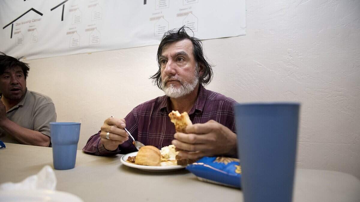 This February 2015 file photo shows Turlock homeless resident Robert Allen eating a meal at the We Care Program in Turlock. The nonprofit in August 2021 resumed its weekly lunch and community participation meetings after a COVID-19 hiatus. 