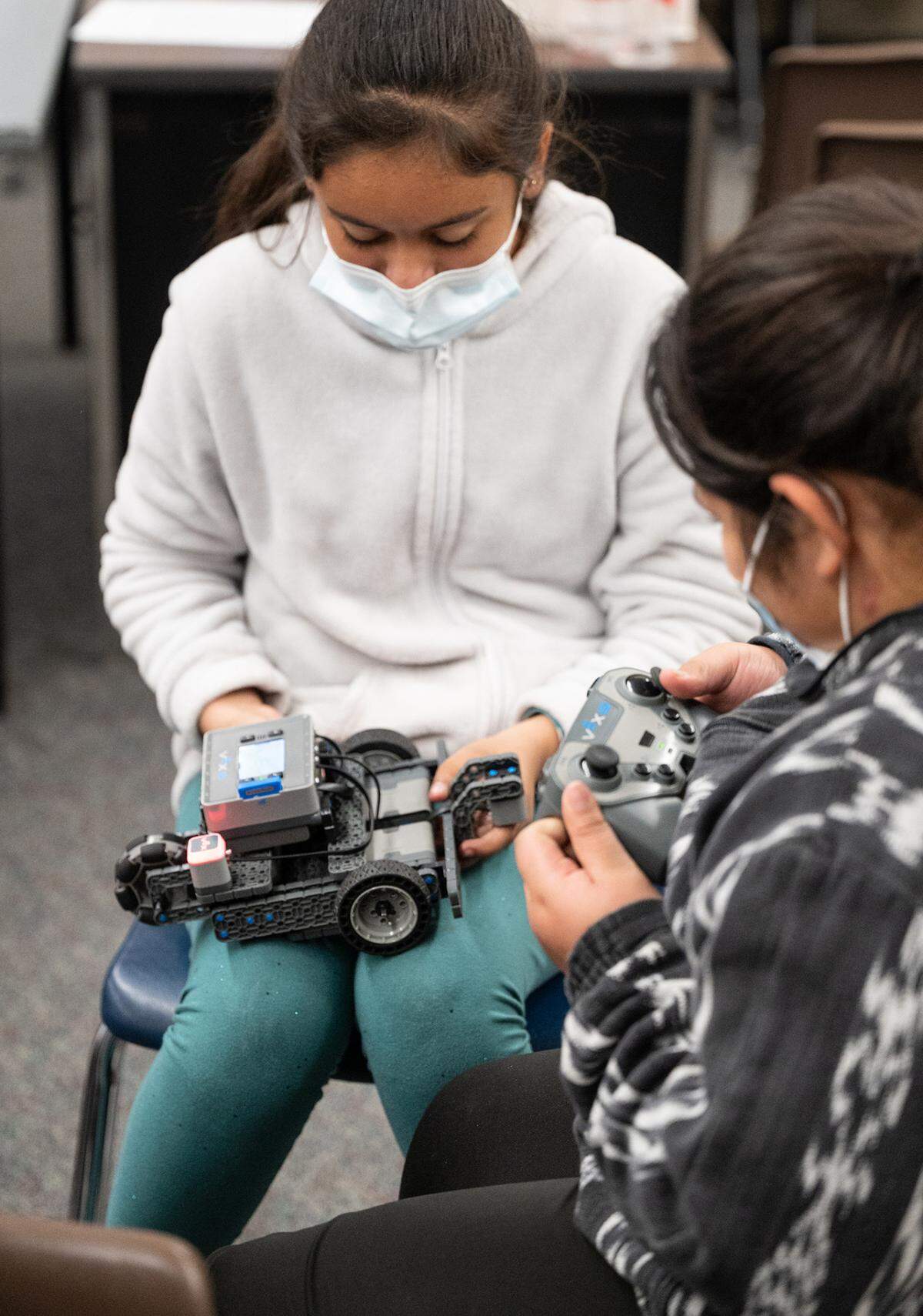Emeely R., left, and Esmeralda O., work with a robot during their fifth grade STEM class at Tuolumne Elementary School in Modesto, Calif., on Thursday, Feb.17, 2022.