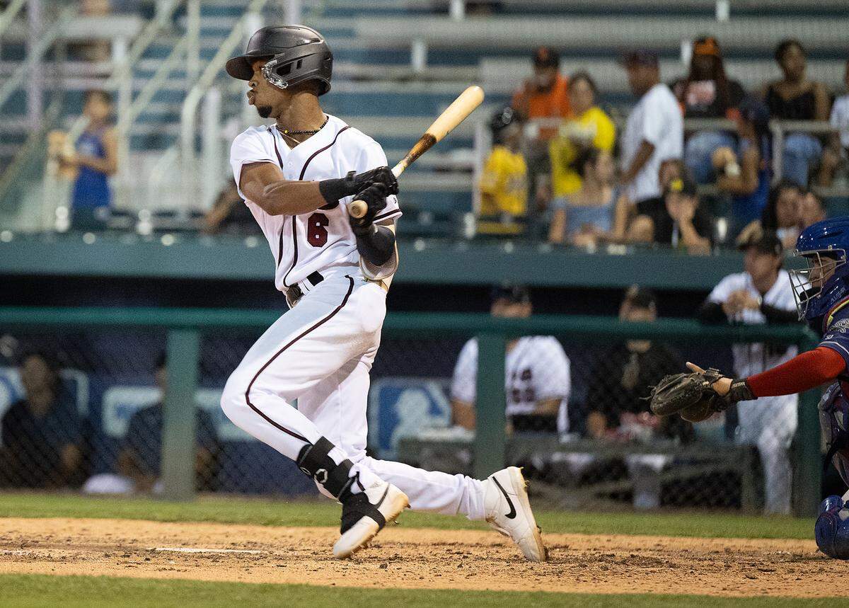 Modesto Nuts’ Curtis Washington Jr. connects for a base hit during the game with Stockton at John Thurman Field in Modesto, Calif., Friday, July 19, 2024.