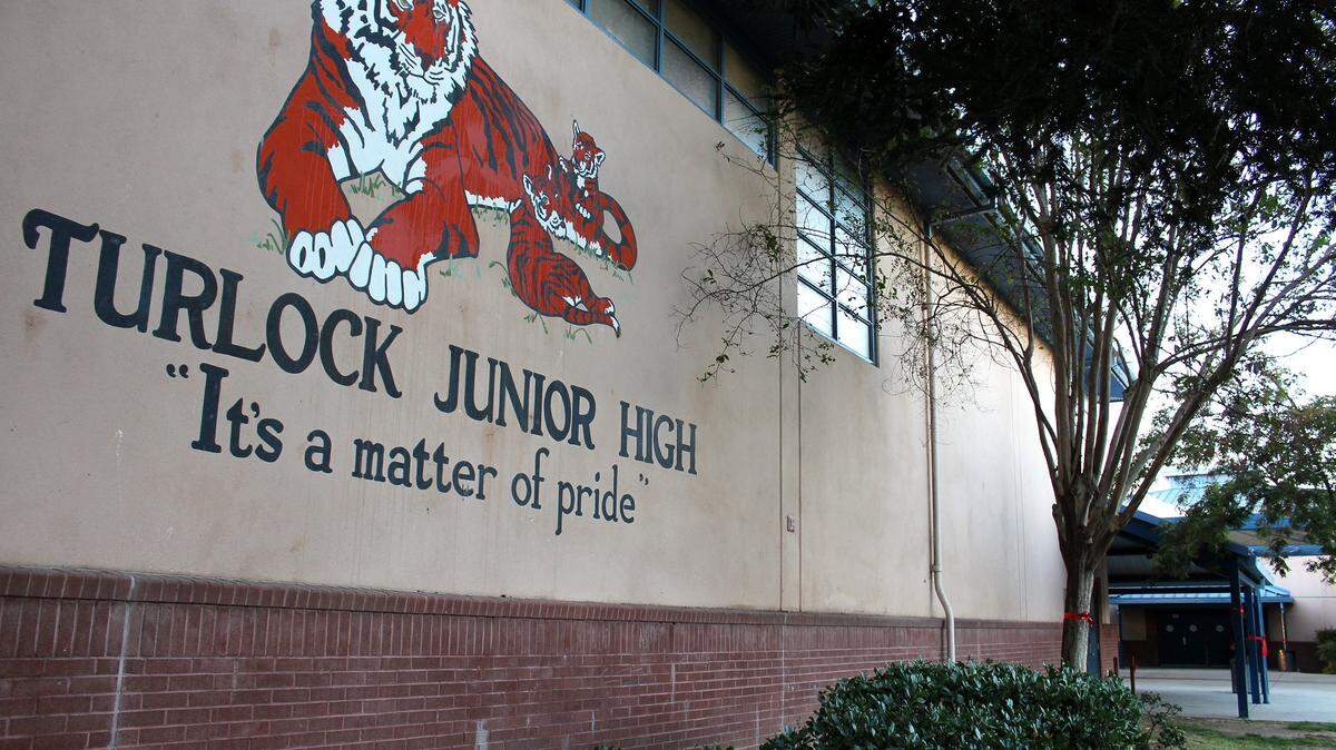 A 12-year-old student at Turlock Junior High was booked into juvenile hall after police say she brandished a knife and  threatened another student's life.