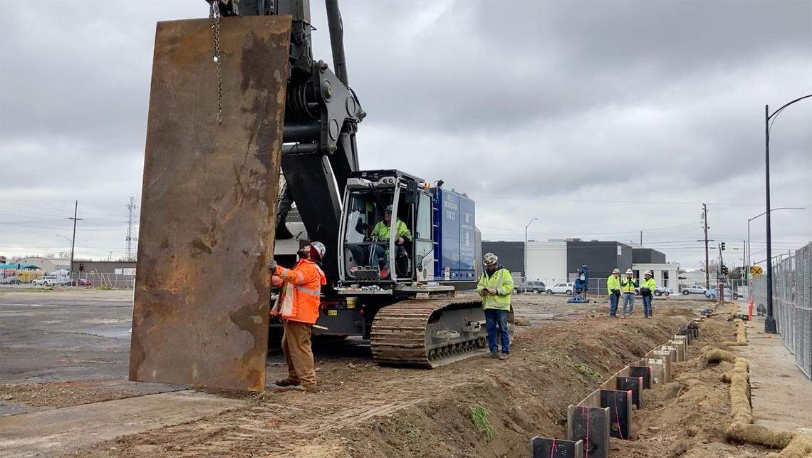 Workers install shoring at the new courthouse site in Modesto, Calif., on Wednesday, Dec. 29, 2021.