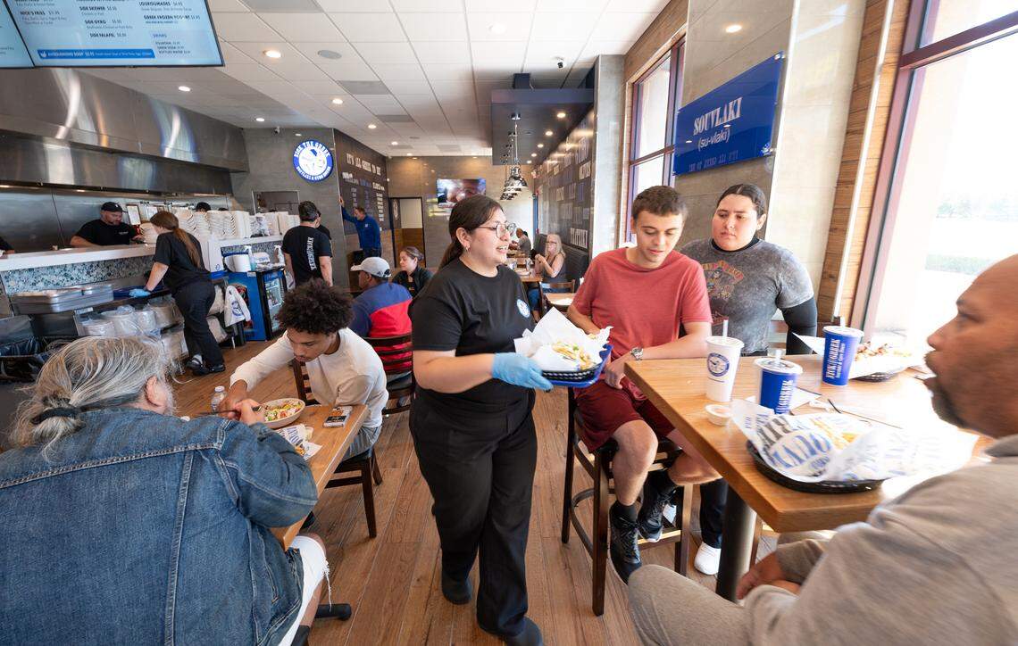Customers enjoyed a free lunch during the grand opening of the Nick the Greek restaurant in Riverbank, Calif., Tuesday, September 12, 2023.