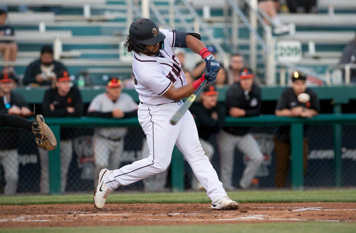 Modesto Nuts catcher Freuddy Batista singles during the opening day game with the San Jose Giants at John Thurman Field in Modesto, Calif., Tuesday, April 11, 2023.