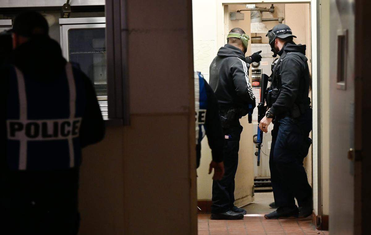 Modesto Police officers participate in an active shooter scenario under the watch of training officers in Modesto, Calif., Wednesday, Feb. 15, 2023.