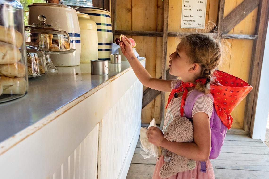 A visitor buys baked goods during a past Columbia Diggins 1852 event at Columbia State Historic Park.