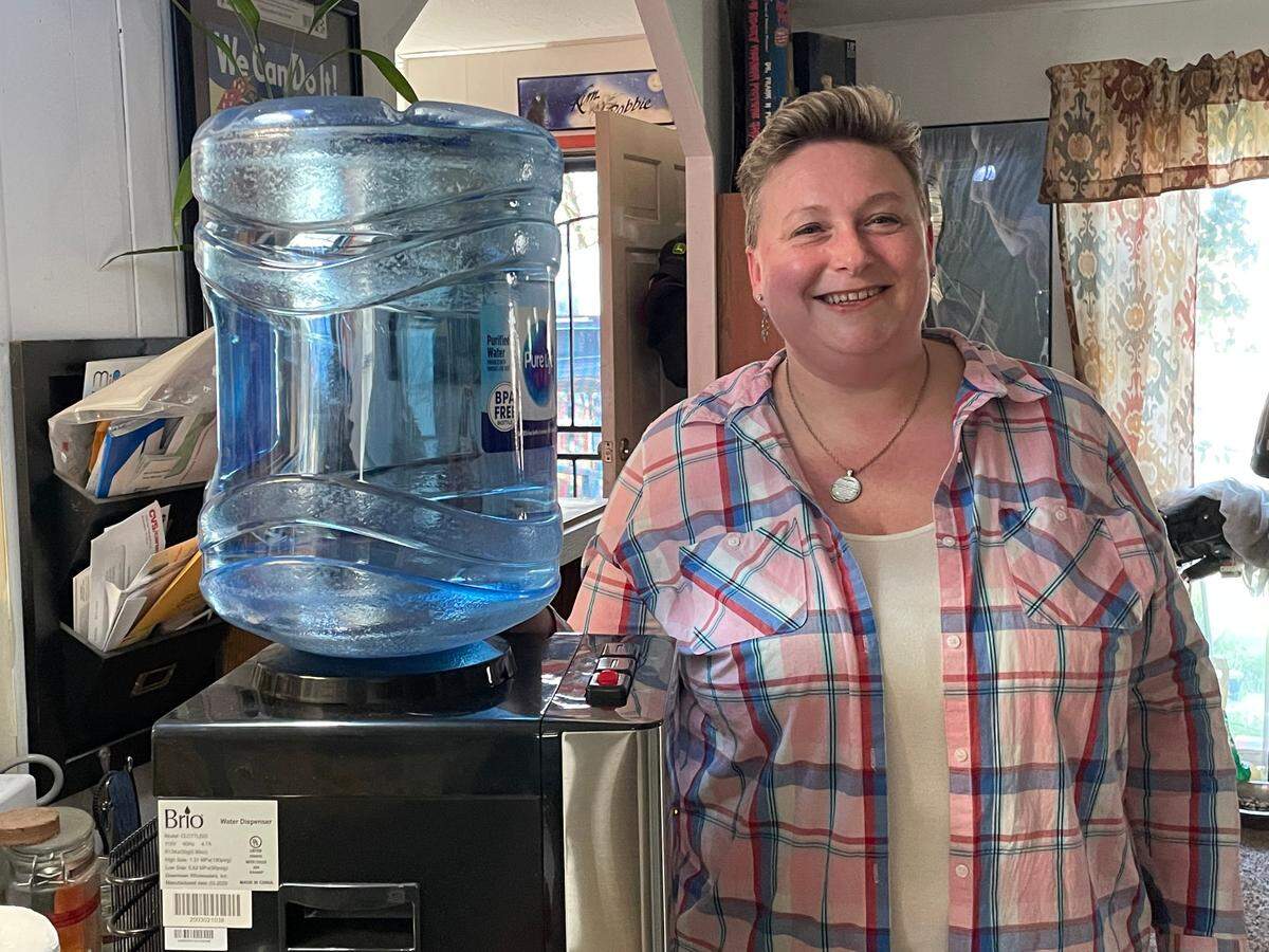Kym Brinkman gets free bottled water due to nitrate contamination of her well off Crows Landing Road near Ceres. She talked about the program March 18, 2022.