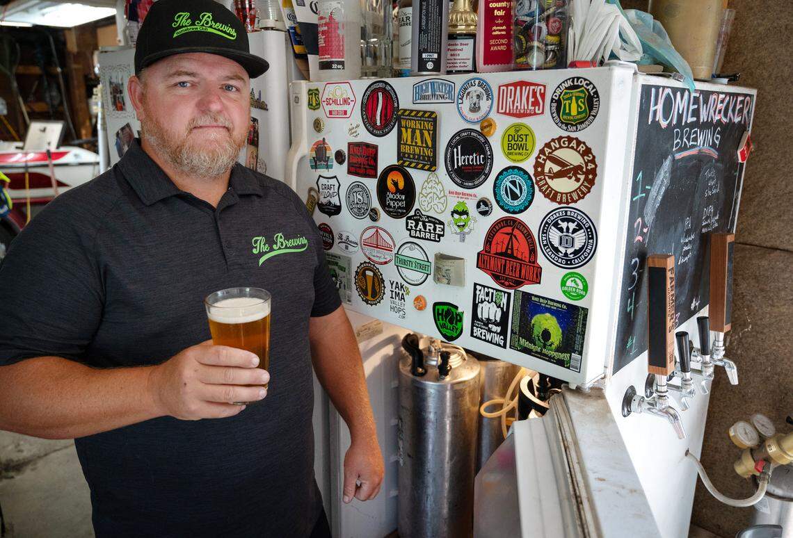 Henry VanderWeide III with cold beer on tap in the kegerator at his home in Ripon, Calif., Friday, August 18, 2023.