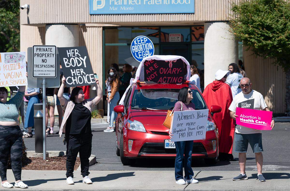 People rally in support of abortion rights outside the Planned Parenthood office on McHenry Avenue in Modesto, Calif., on Saturday, May 14, 2022.