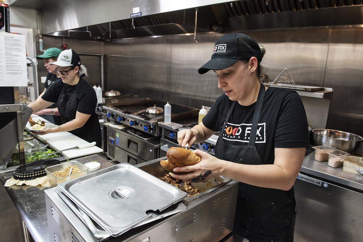 Cook Jennifer Kaminski puts together a sandwich at Food Fix Butcher & Baker restaurant in Modesto, Calif., Thursday, Aug. 22, 2019.