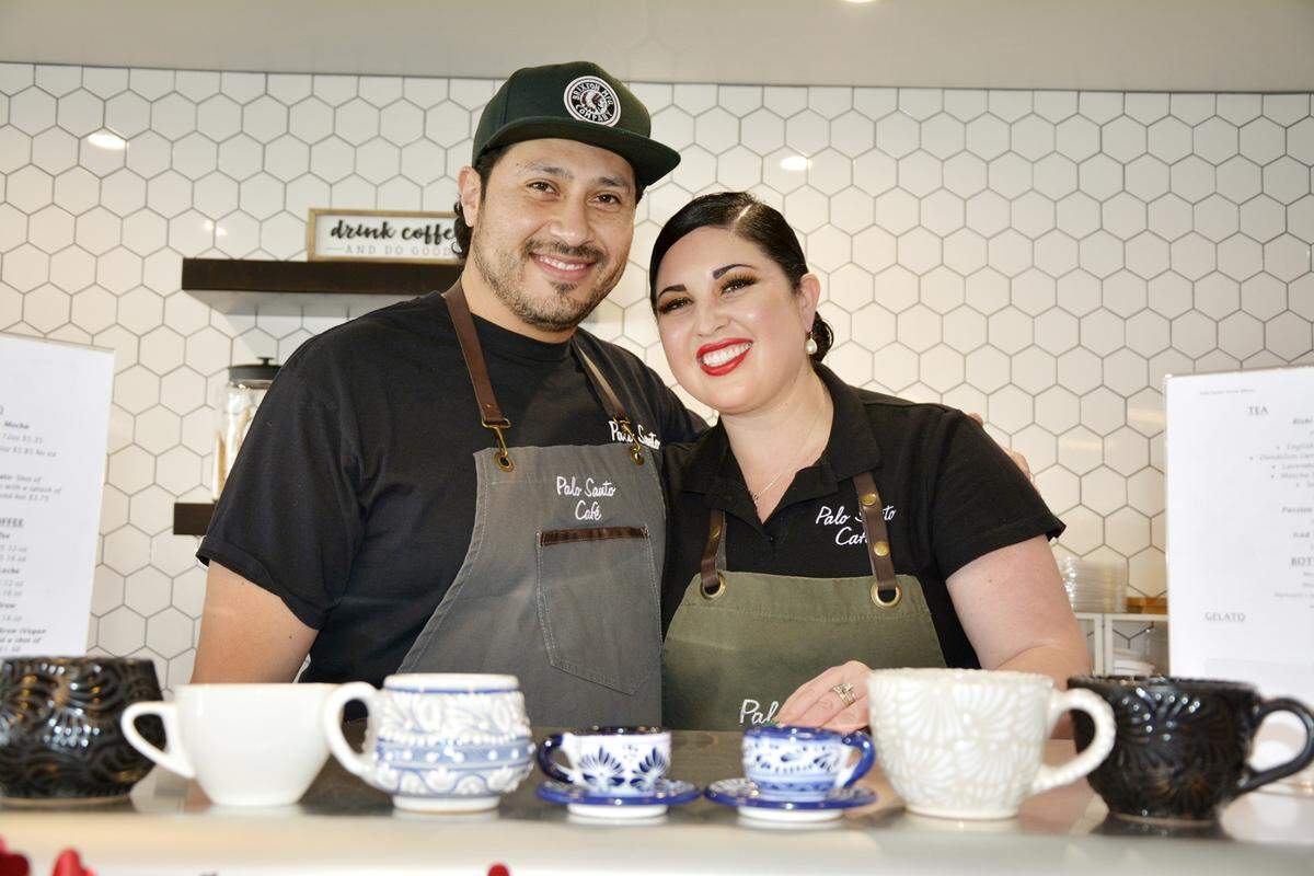 Palo Santo Cafe husband-and-wife owners Christian and Nayeli Vazquez in their new coffee shop in Riverbank, Calif. Feb. 23, 2021.