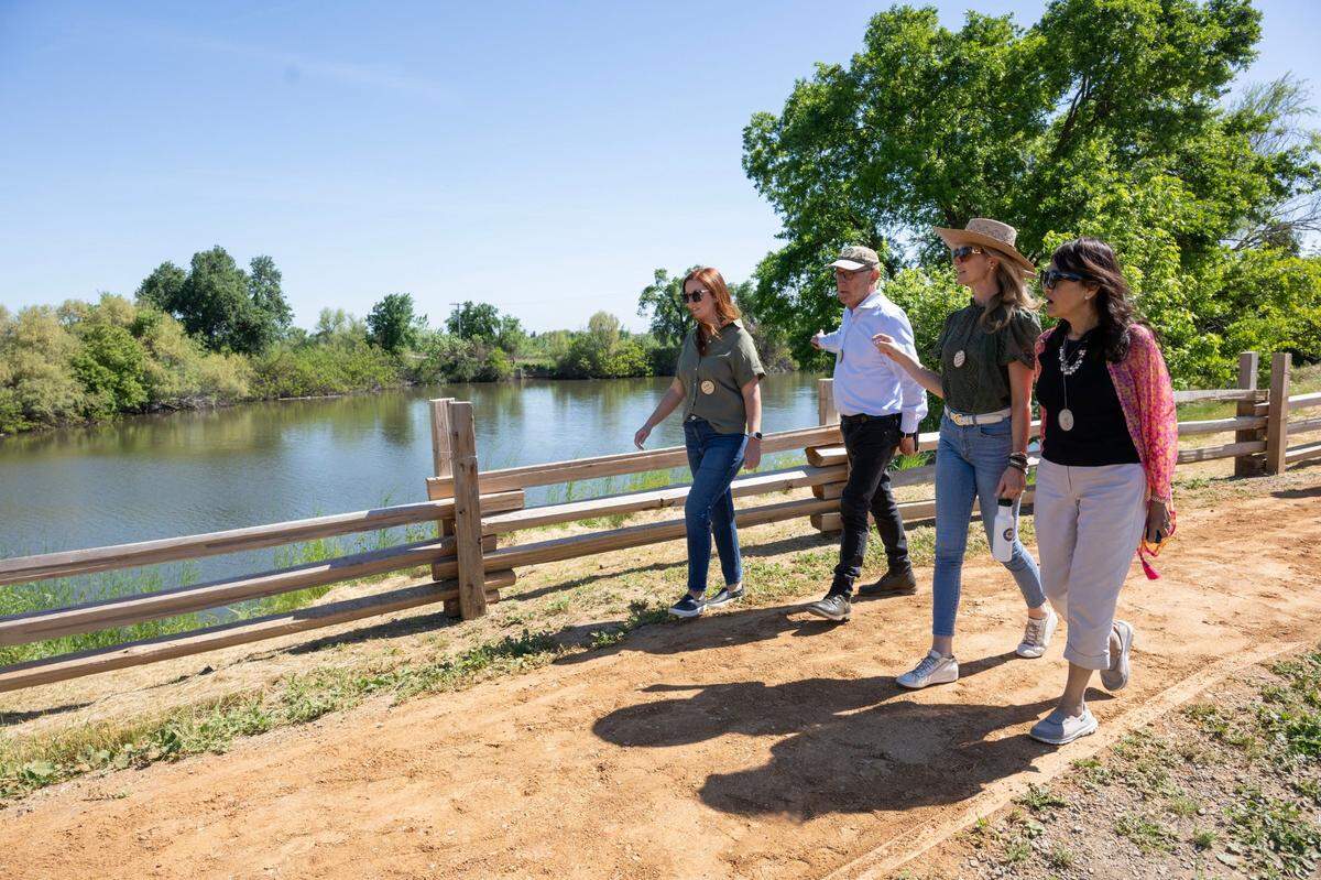 California First Partner Jennifer Siebel Newsom, second from right, tours the new Dos Rios State Park with, from left, State Parks Chief Deputy Director Liz McGuirk, State Parks Director Armando Quintero and Surgeon General Dr. Diana Ramos in the San Joaquin Valley on Monday.