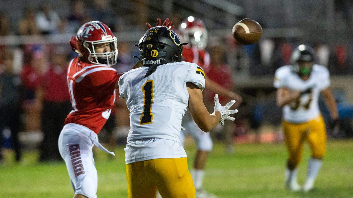 Hughson’s Alex Villarreal makes an interception and returned it for the Huskies first touchdown during the Trans Valley League game with Modesto Christian at Modesto Christian High School in Salida, Calif., Thursday, September 29, 2022. Hughson won the game 48-12.