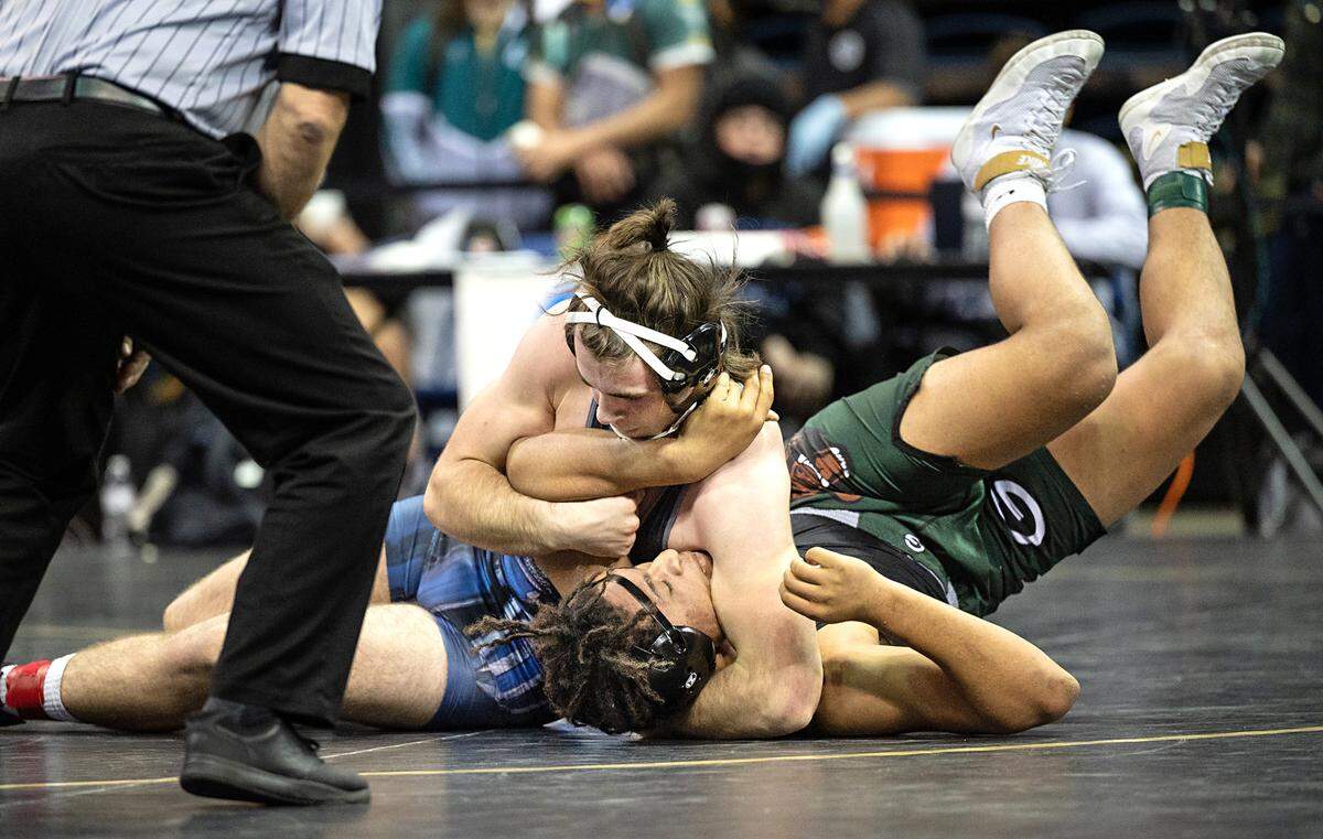 Downey wrestler Tyler Sanchez won fifth place in the 195-pound match with a pin of Granite Bay’s Derrall Sheldon during the CIF Sac-Joaquin Section Masters Wrestling Tournament at the Stockton Arena in Stockton, Calif., on Saturday, Feb. 19, 2022.